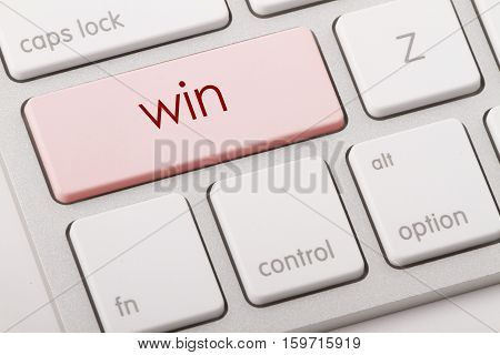 Win word written on computer keyboard .