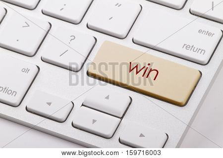 Win word written on computer keyboard .