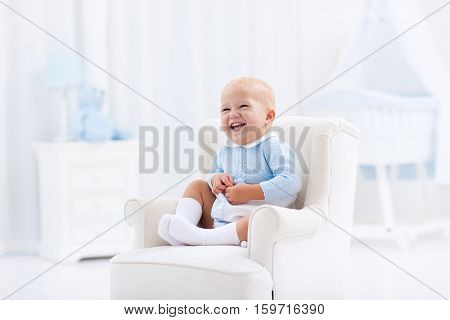 Baby Boy Playing In Bedroom