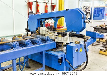 Semi auto band saw in mechanical workshop