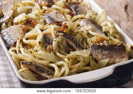 Italian Pasta Bucatini With Sardines, Fennel, Raisins And Pine Nuts Close Up. Horizontal