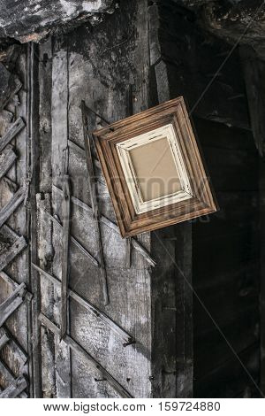 Retro wooden frame on the wall of the barn