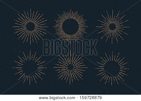Set of vintage hand drawn sunbursts on dark background. Starburst, sunrays. Design elements.