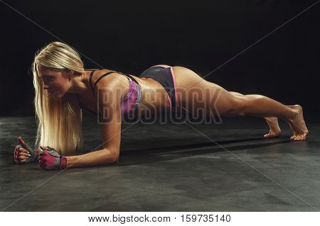 beautiful sexy sports girl on a dark background