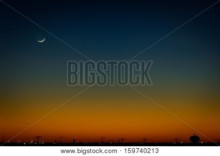 North Houston, Texas Sunset and Moon-rise with power line silhouette.