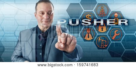 Smiling male oil rig manager touching PUSHER on an interactive control monitor. Oil and gas industry metaphor for a coordinator position among resource extraction occupations in petroleum production.