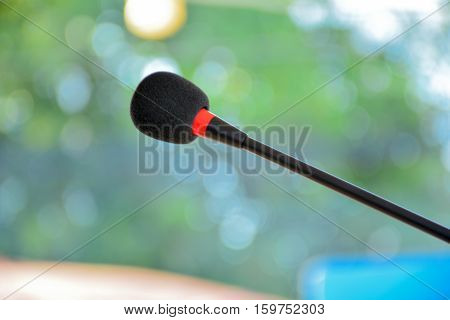 The black microphone and red light at the morning.