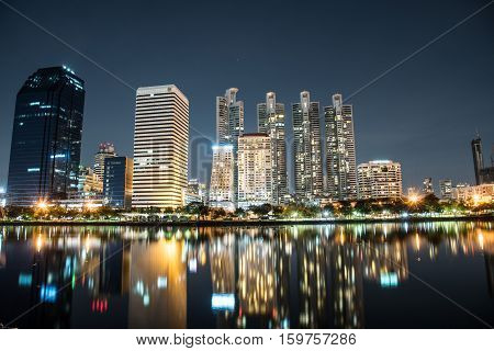 modern night cityscape in Benchakitti Park thailand