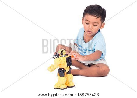 cute child asian little boy playing with robot fighting toy