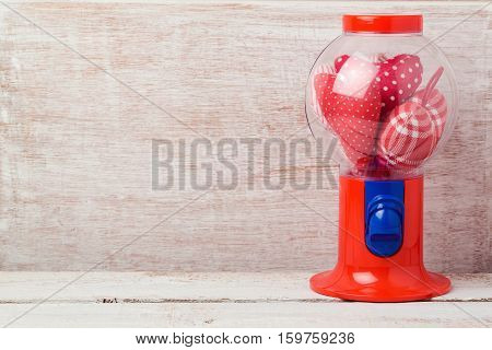 Valentine's day background with gumball machine and heart shape