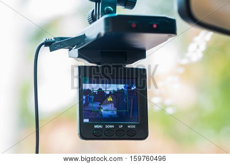 Car video recorder installed on a rear view mirror
