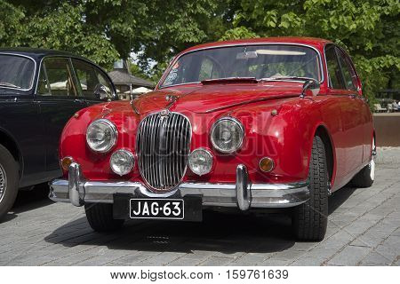 TURKU, FINLAND - JUNE 13, 2015: Red Jaguar Mk-1 - the participant of parade of vintage cars