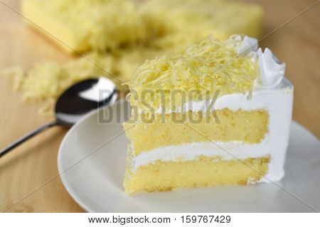 piece of cake with whip cream and grated cheese toppingselective focus.