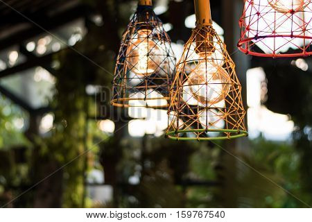 beautiful Light bulb incandescent hanging decorated interior roomselective focus.