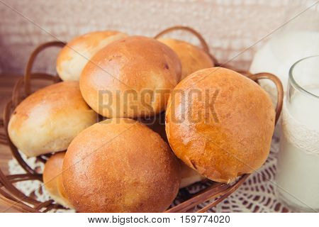 fresh pies with milk on light background