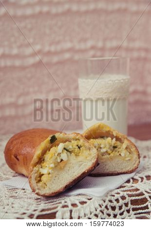 fresh pies with milk on light background
