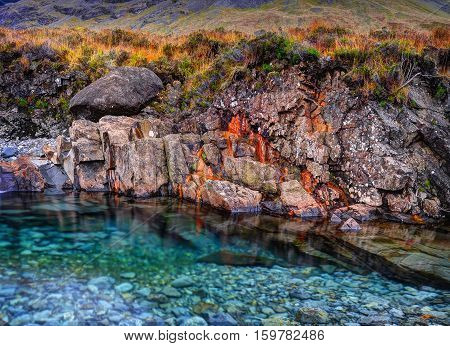 Rusted rocks in Fairy Pools Glen Brittle Isle of Skye Inner Hebrides Highlands Scotland