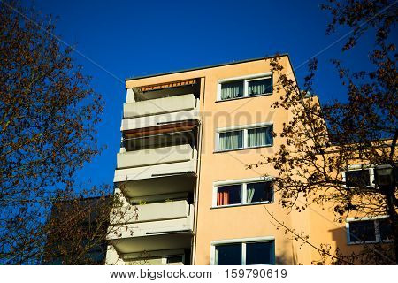 Multi-family house with balcony in Munich, blue sky