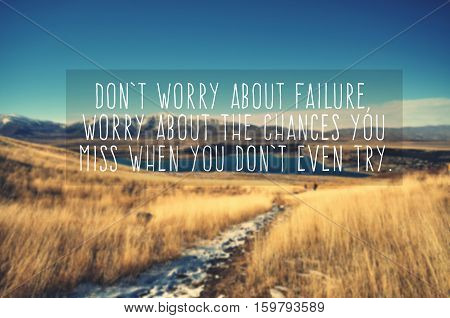 Inspirational life quote - don't worry about failure worry about the chances you you miss when you don't even try. Blurry and vintage style background.