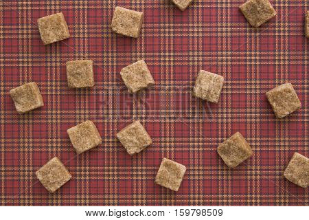 Brown sugar cubes pattern background. Top view. Diet unhealty sweet addiction diabetic concept