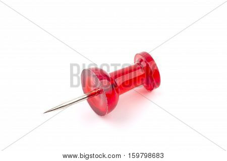 Macro close up of Red Push Pin isolated on white background.