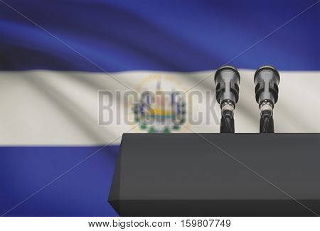 Pulpit And Two Microphones With A National Flag On Background - El Salvador