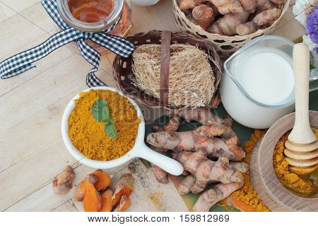 Turmeric powder with honey and milk for scrub