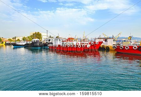 red boats at the industrial area of Eleusis Greece
