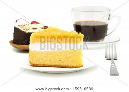 Chiffon cake garnished with foi thong in white plate with chocolate cake and a cup of black coffee on white background