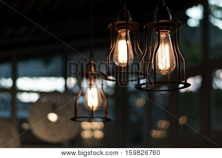 beautiful Light bulb incandescent hanging decorated interior roomselective focus.