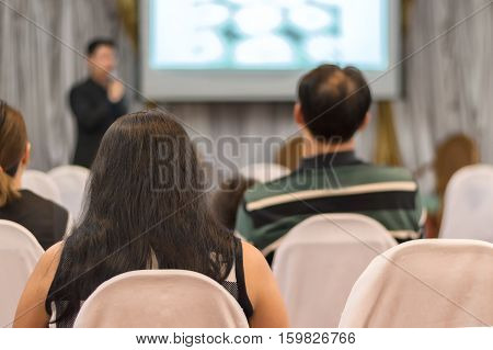 people listen in business seminar hall of hotel roomselective focus.
