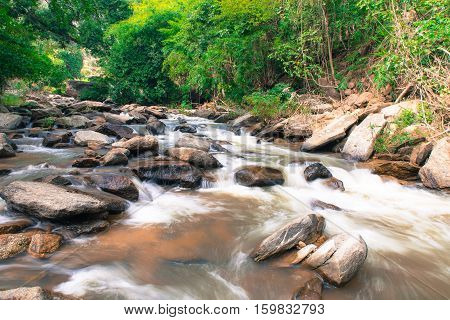 Mae Ya waterfall with green trees and small creekbackgroundat Doi Inthanon National Park Chiangmai Thailand