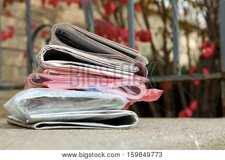 A pile of newspapers on a stairs