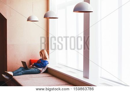The blonde with a laptop in a modern office