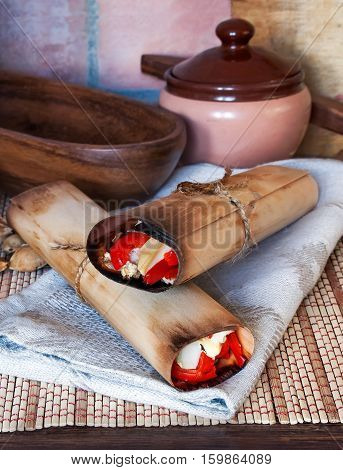 Native North American Indians cuisine. National food: vegetables and meat baked in the wood-paper