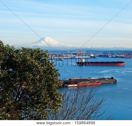 Tacoma Port With Cargo Ships And Volcano Mt. Ranier.