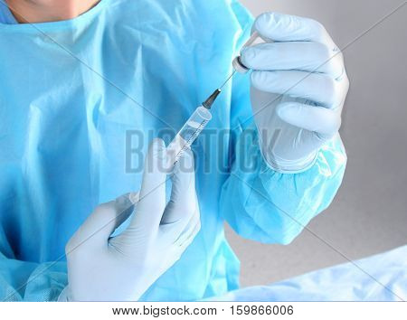 Surgeon hand hold scalpel and tweezers while cut and cure wound closeup. Resuscitation and or, injury heal, medic shop or store, saving patient, 911, surgery and emergency, put stitch concept