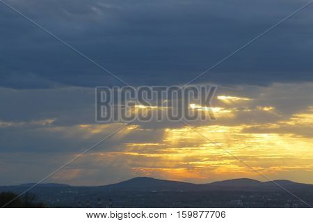 Rays of sunlight passing through clouds. Quebec, Canada.