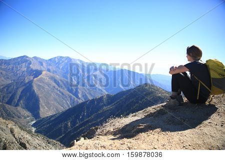 Hiker viewing the valley below Mt. Baden-Powell.