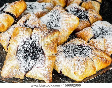 Danish Pastry With Blueberry Jam Filling With White Powdered Sugar
