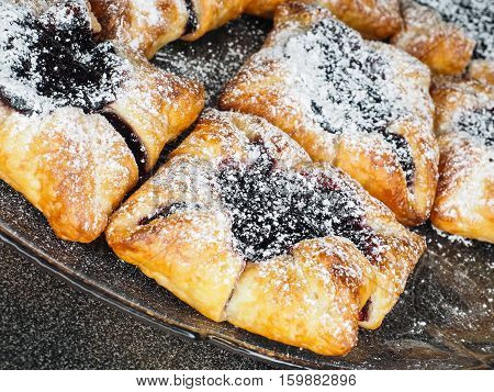 Danish Pastry With Blueberry Jam Filling With White Powdered Sugar