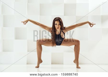 Beautiful Sexy Brunette Posing In Swimsuit On White Background