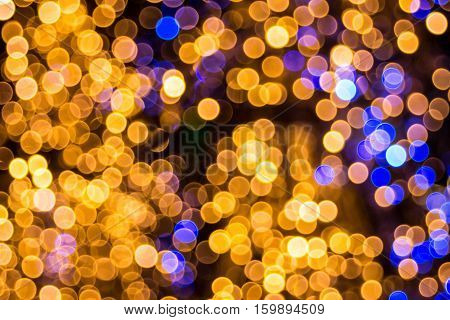 Bokeh-abstraction: Intertwisted glare of gold and diamonds.