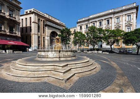 CATANIA ITALY - AUGUST 17 2016: 18th century Dolphins fountain on the Piazza Vincenzo Bellini originally designed by Giovanni Battista Vaccarini restored by Salvatore Giordano in the 1950s.