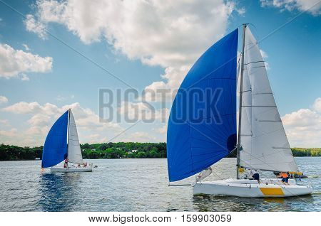 Sailing yacht race. Team athletes participating in the sailing competition
