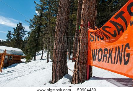 SnowCat Working Sign at Sipapu New Mexico a small town outside of Santa Fe, NM, USA at a snow covered winter wonderland a small Ski Resort.