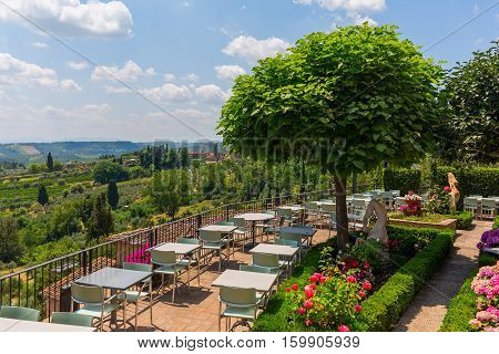 Outdoor Restaurant Over Tuscan Landscape