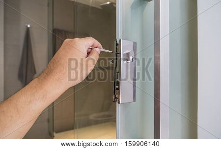 locksmith repair a silver lock on bathroom door - can use to display or montage on product