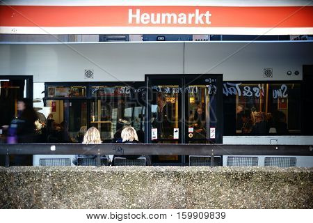 COLOGNE, GERMANY - NOVEMBER 24: The tram stop Heumarkt with passengers and a tram in the old town on November 24 2016 in Cologne.