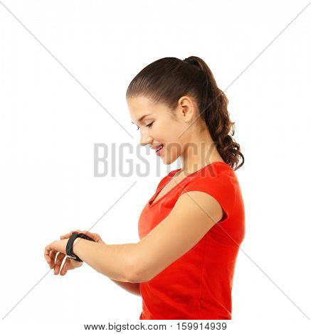 Beautiful young woman with pulsometer on white background